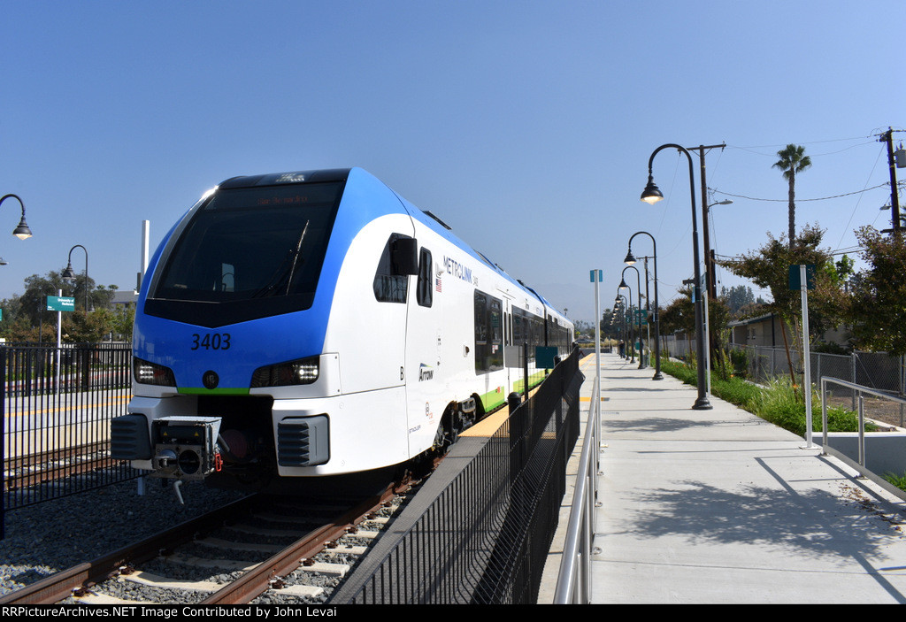 Early afternoon westbound getting ready to depart Redlands University Station 